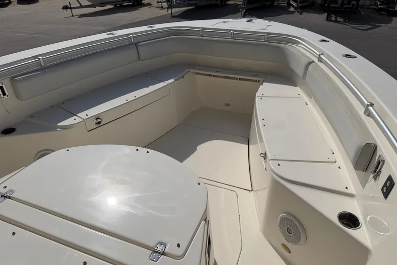 Slide: The Image of 2015 Cobia 344 Center Console boat interior with seating and storage compartments. - 66