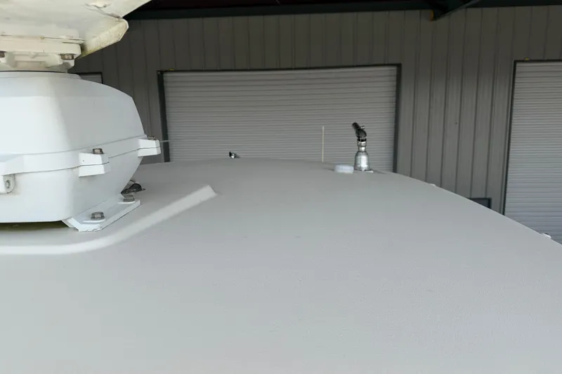 Slide: The Image of 2015 Cobia 344 Center Console boat roof with mounted equipment in storage. - 68