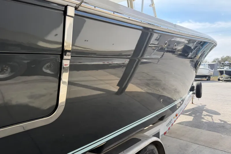 Slide: The Image of 2015 Cobia 344 Center Console boat on trailer, side view. - 7