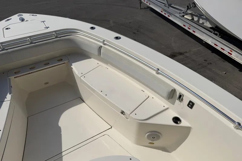 Slide: The Image of 2015 Cobia 344 Center Console boat interior with seating and storage compartments. - 72