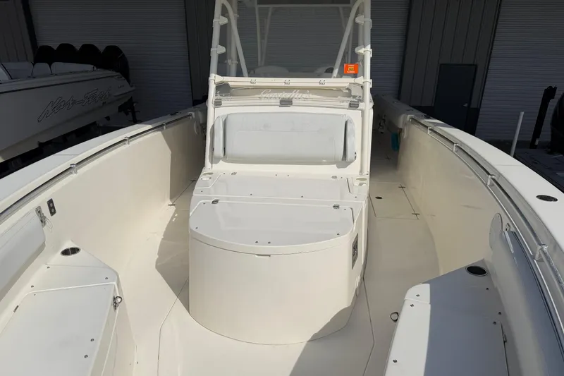 Slide: The Image of 2015 Cobia 344 Center Console boat interior with seating and storage compartments. - 81