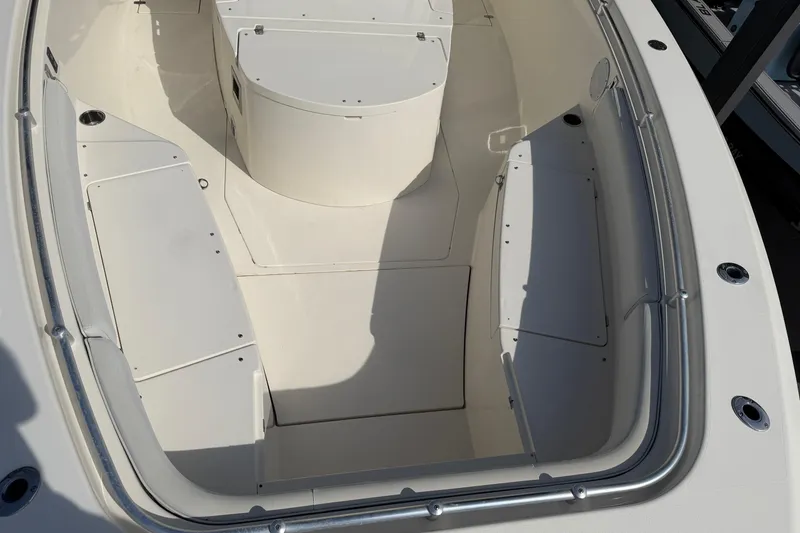 Slide: The Image of 2015 Cobia 344 Center Console boat interior with storage compartments. - 82