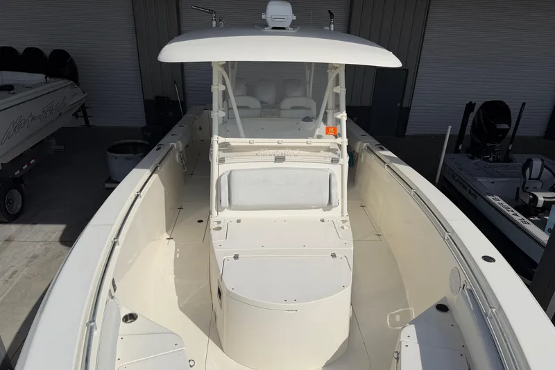 Slide: The Image of 2015 Cobia 344 Center Console boat in a storage facility, top view. - 83
