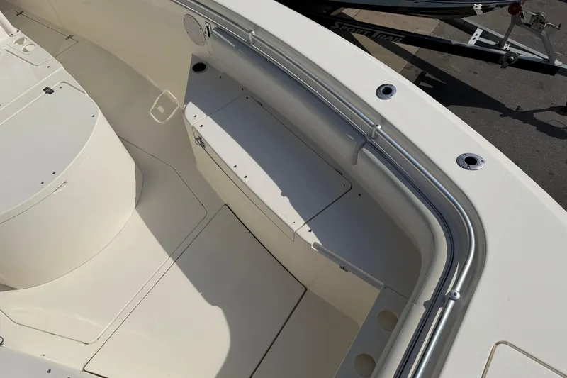 Slide: The Image of 2015 Cobia 344 Center Console boat interior with seating and storage compartments. - 84