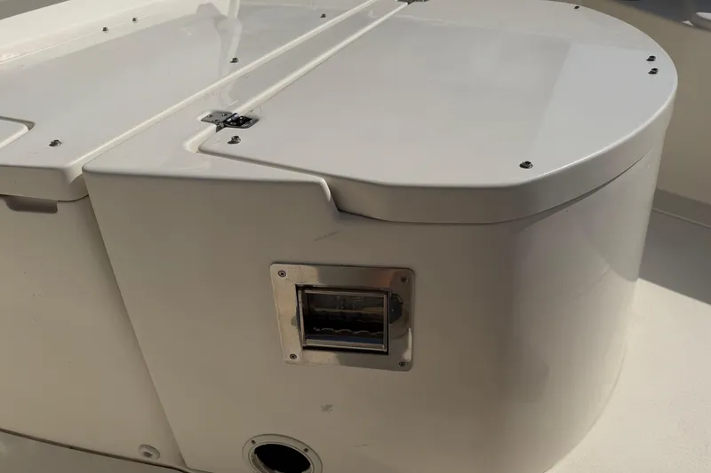 Slide: The Image of 2015 Cobia 344 Center Console boat detail, featuring sleek white surface and hardware. - 85