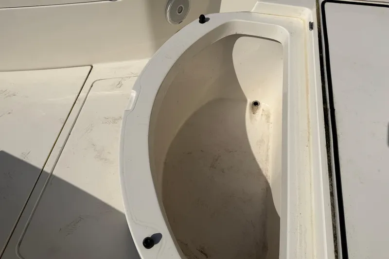 Slide: The Image of 2015 Cobia 344 Center Console boat storage compartment detail. - 91