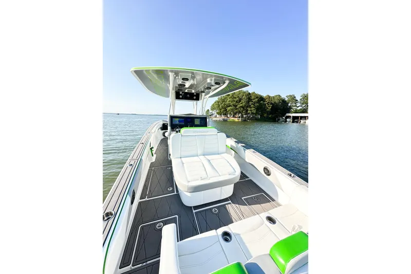 Slide: The Image of 2023 Statement 350 Open boat with sleek design on a serene lake. - 14