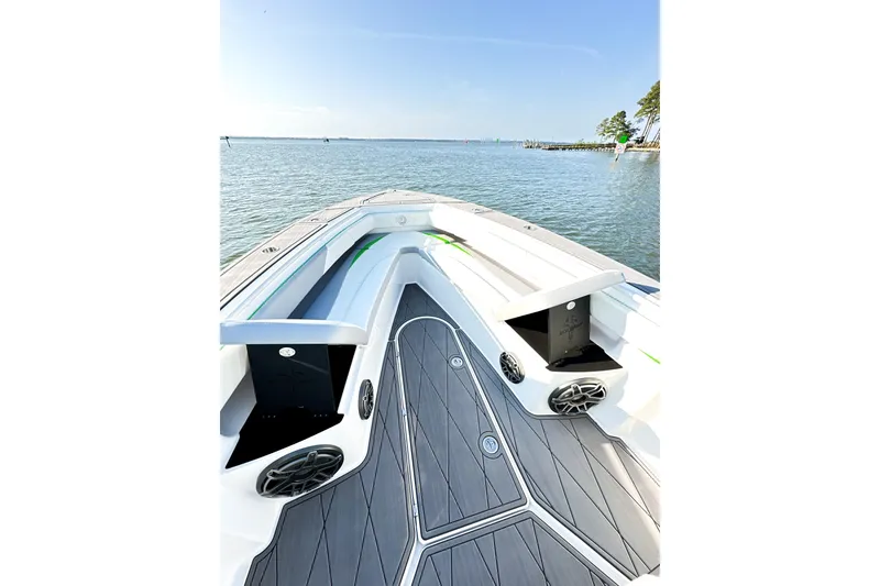 Slide: The Image of 2023 Statement 350 Open boat on calm water, featuring sleek deck design. - 19