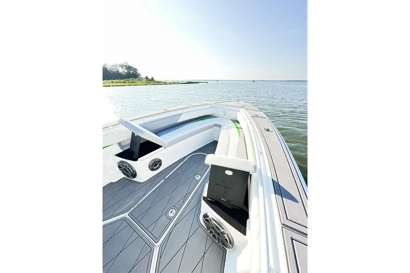 Slide: The Image of 2023 Statement 350 Open boat interior with sleek seating and modern design on calm water. - 20