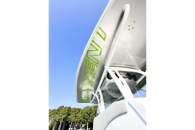 Slide: The Image of 2023 Statement 350 Open boat with sleek design and vibrant green accents. - 22