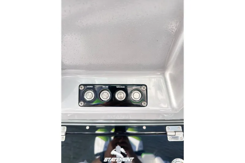 Slide: The Image of Control panel of 2023 Statement 350 Open boat with horn, bilge, nav, and lights switches. - 25