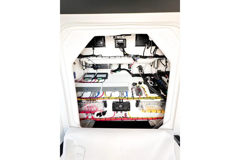 Slide: The Image of Interior view of 2023 Statement 350 Open boat's electrical system with organized wiring. - 33