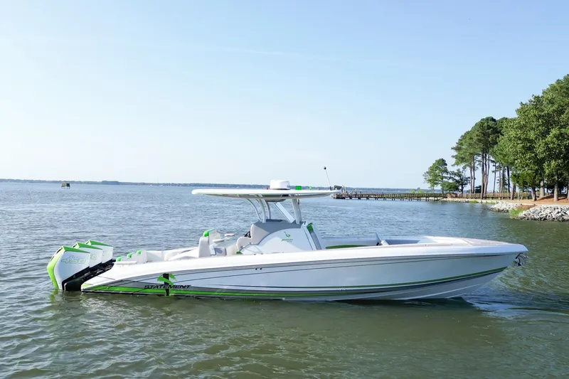 Slide: The Image of 2023 Statement 350 Open boat on calm water near a wooded shoreline. - 4