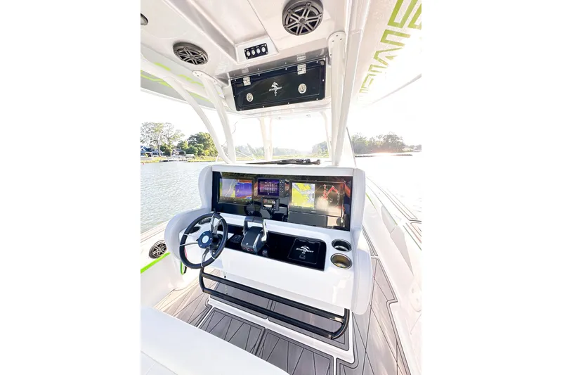 Slide: The Image of 2023 Statement 350 Open boat cockpit with advanced navigation displays and steering wheel. - 7