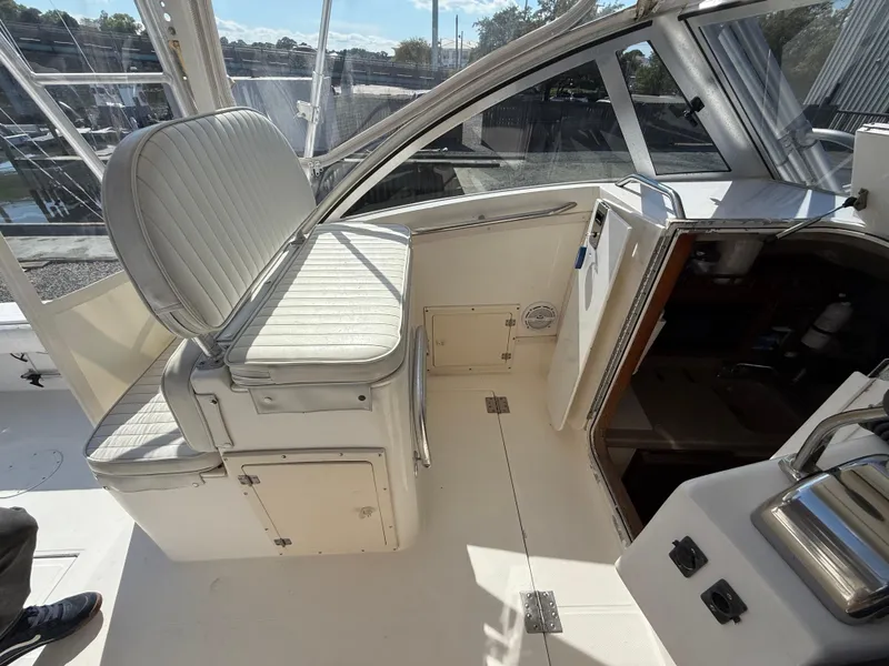 Slide: The Image of 2001 Albemarle 280 Express Sport Fisherman interior with seating and cabin entrance. - 11