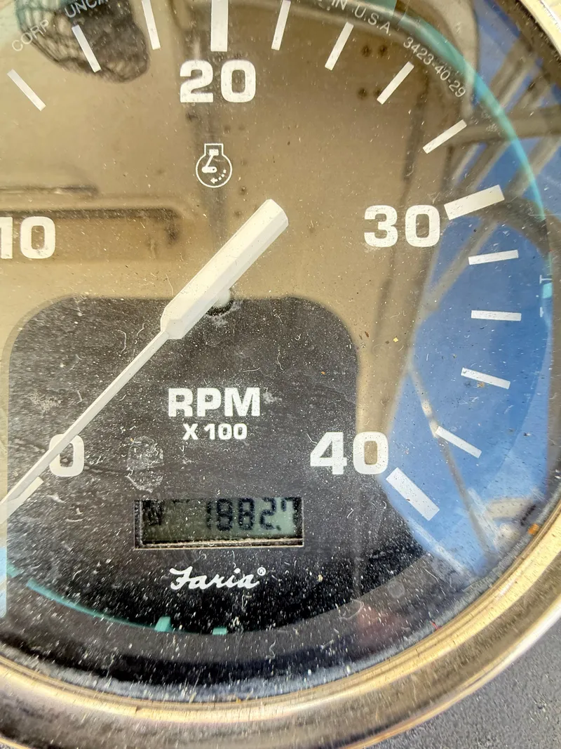Slide: The Image of Close-up of a 2001 Albemarle 280 Express Sport Fisherman RPM gauge showing 1982.7 hours. - 41