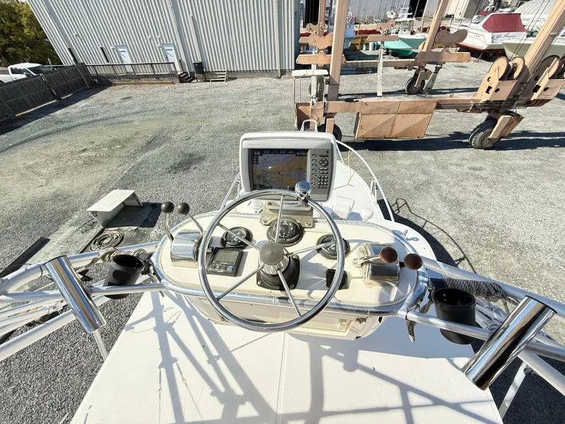 Slide: The Image of 2001 Albemarle 280 Express Sport Fisherman helm with navigation equipment and controls. - 7