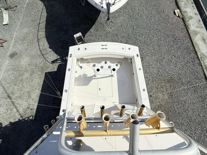 Slide: The Image of 2001 Albemarle 280 Express Sport Fisherman boat, aerial view, docked on gravel. - 9
