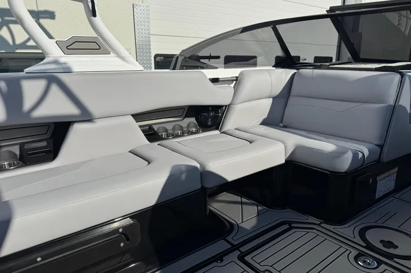 Slide: The Image of 2026 Moomba Mojo boat interior with sleek white seating and modern design. - 10