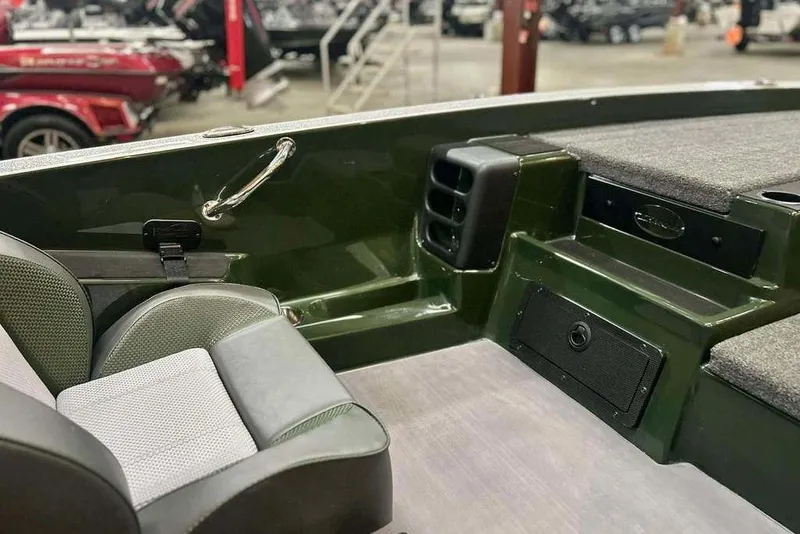 Slide: The Image of 2026 Triton 19 TrX boat interior with seating and storage compartments. - 10