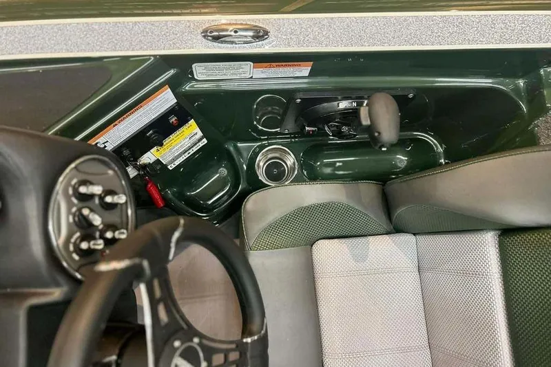 Slide: The Image of 2026 Triton 19 TrX boat cockpit with steering wheel and control panel. - 13
