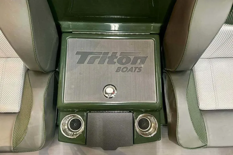 Slide: The Image of 2026 Triton 19 TrX boat interior with logo and cup holders. - 15