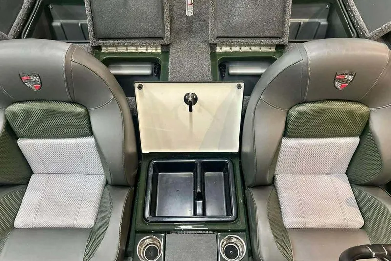 Slide: The Image of 2026 Triton 19 TrX boat interior with dual seats and storage compartments. - 16