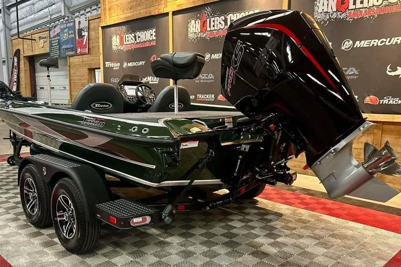 Slide: The Image of 2026 Triton 19 TrX boat on display with powerful outboard motor. - 5