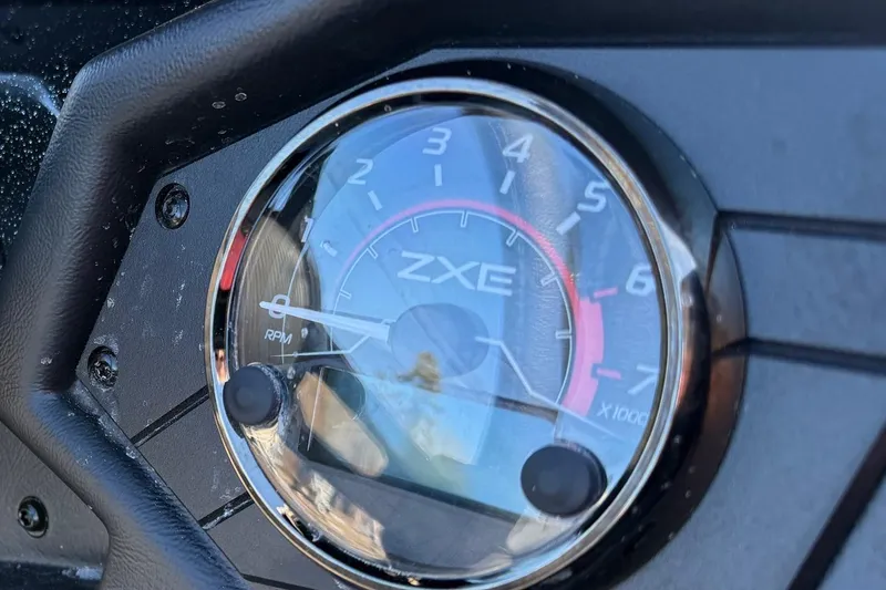 Slide: The Image of Close-up of 2026 Skeeter ZXE21 tachometer displaying RPM gauge. - 10