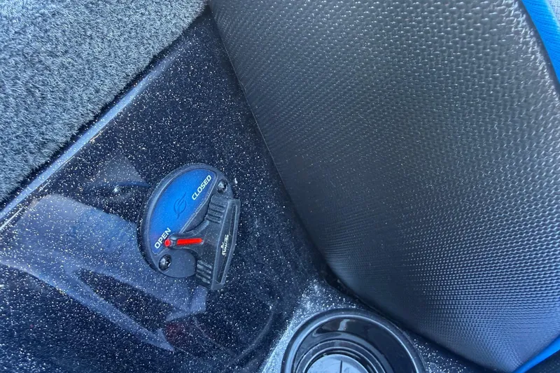 Slide: The Image of 2026 Skeeter ZXE21 boat interior detail with textured surfaces and control switch. - 11