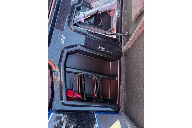 Slide: The Image of 2026 Skeeter ZXE21 boat storage compartment with equipment and accessories. - 26