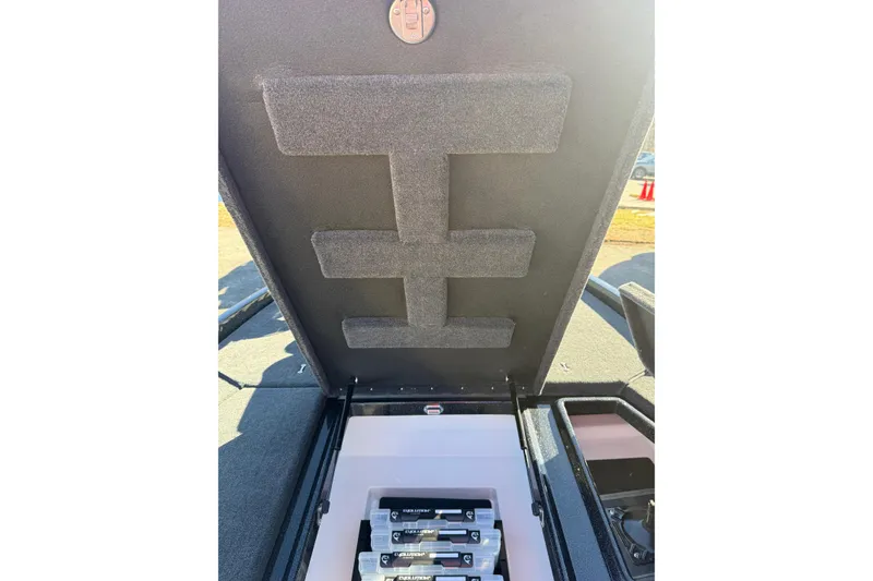 Slide: The Image of 2026 Skeeter ZXE21 boat storage compartment with organized battery setup. - 30