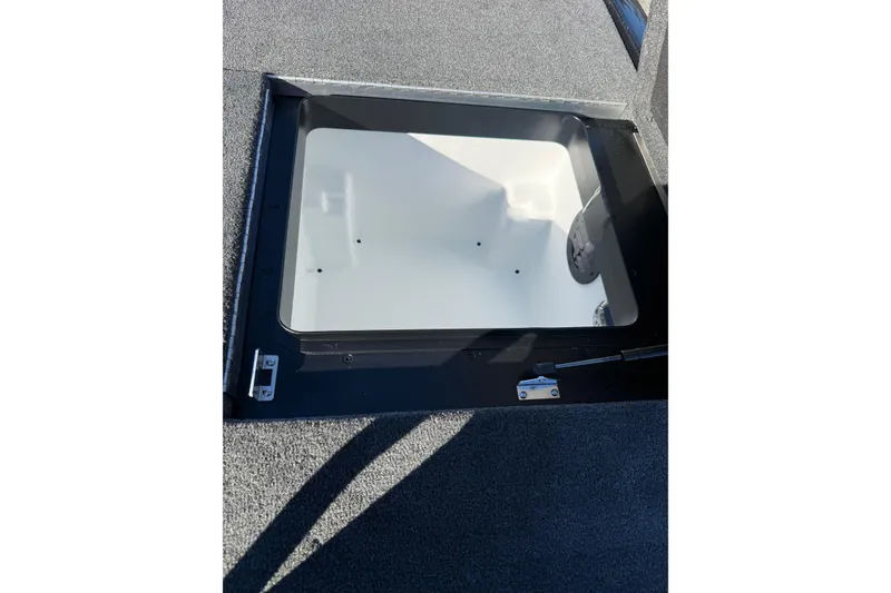 Slide: The Image of 2026 Skeeter ZXE21 boat storage compartment with open hatch, showcasing interior design. - 34