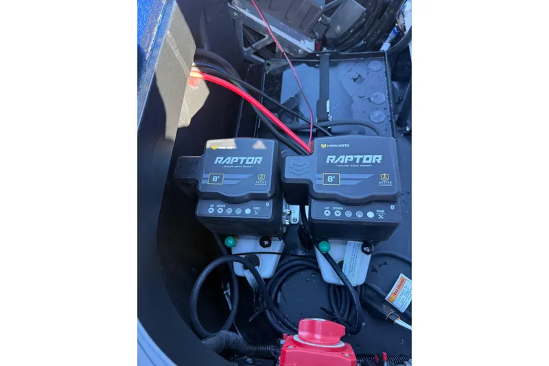 Slide: The Image of Minn Kota Raptor stabilizer in 2026 Skeeter ZXE21 boat compartment. - 39