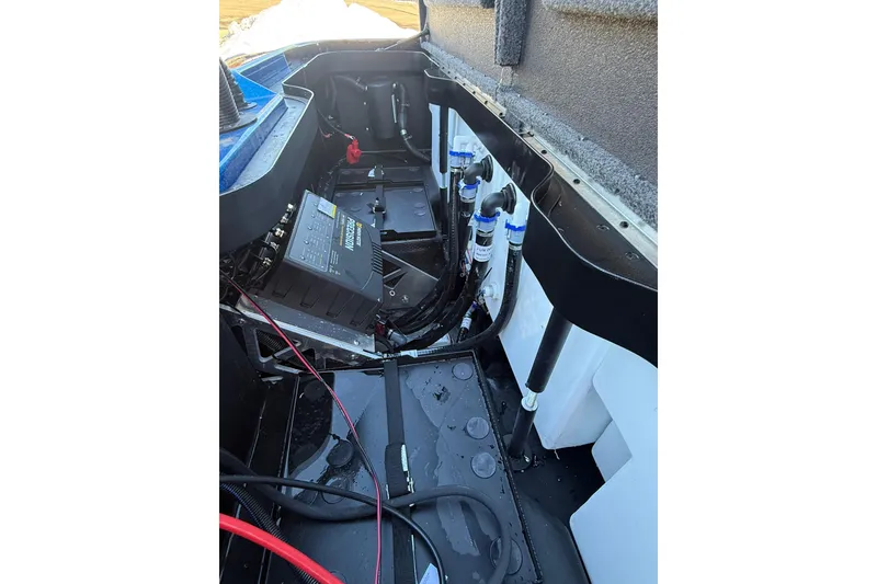 Slide: The Image of 2026 Skeeter ZXE21 boat interior showing battery and wiring components. - 41