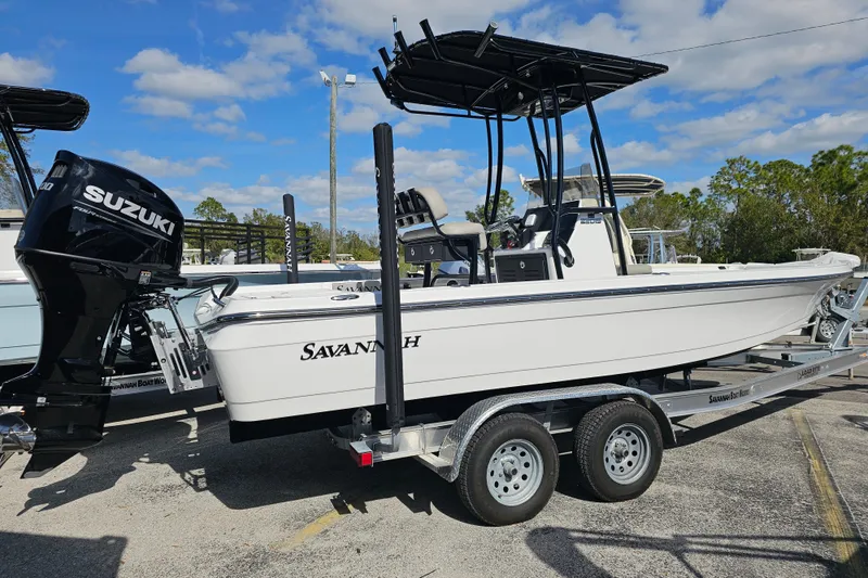 The Image of 2025 Savannah 220 IS boat on trailer with Suzuki outboard motor. - 0