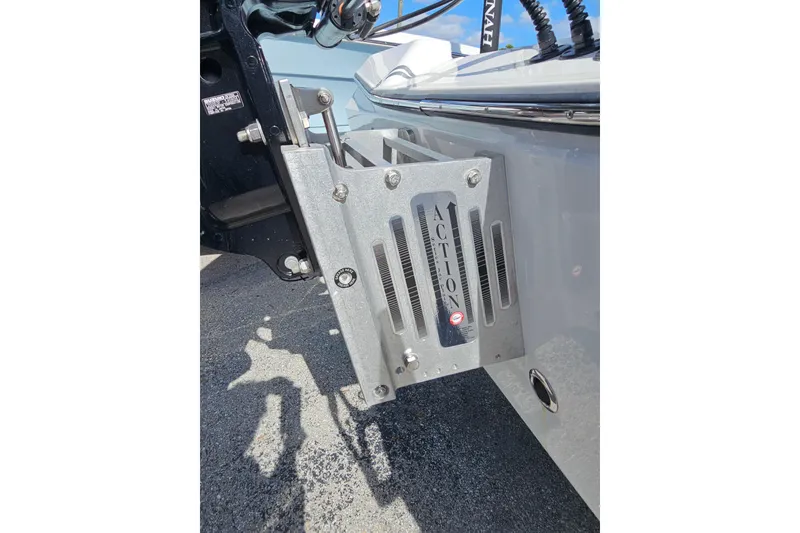 Slide: The Image of Close-up of 2025 Savannah 220 IS boat's motor mount with "Action" branding. - 13