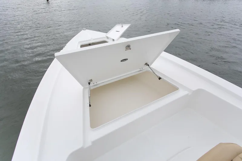 Slide: The Image of Manufacturer Provided Image: Savannah 220 IS 2025 boat with open storage compartment on calm water. - 16