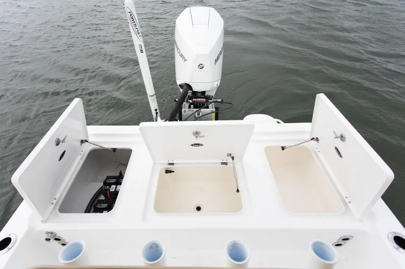 Slide: The Image of Manufacturer Provided Image: Rear view of Savannah 220 IS boat with open storage compartments, 2025 model. - 18
