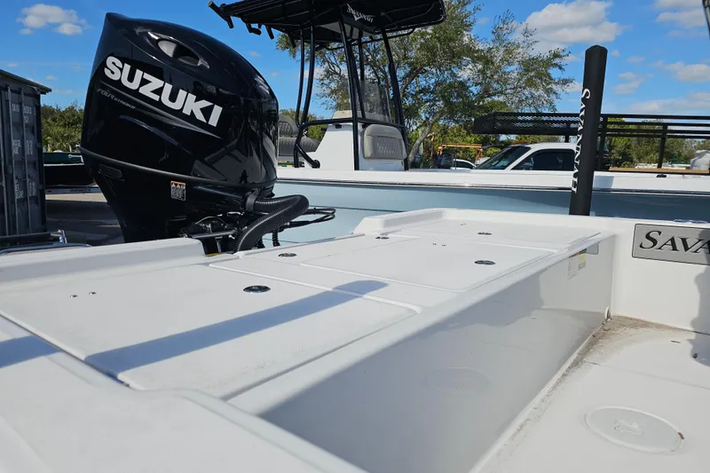 Slide: The Image of Savannah 220 IS 2025 boat with Suzuki outboard motor. - 2