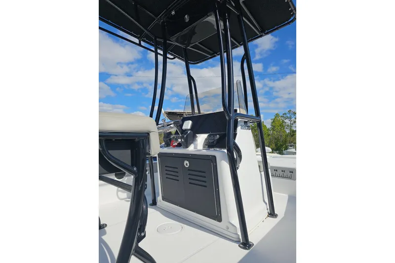 Slide: The Image of 2025 Savannah 220 IS boat console with black frame and clear sky background. - 4