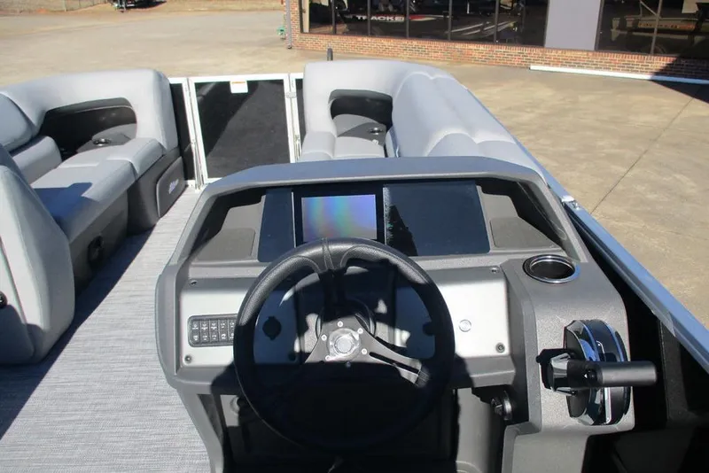 Slide: The Image of 2026 Sun Tracker Party Barge 20 DLX pontoon boat interior with steering console. - 7
