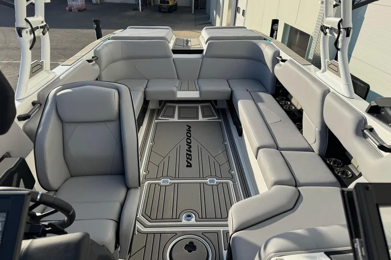Slide: The Image of 2026 Moomba Tykon boat interior with gray seating and modern design. - 1