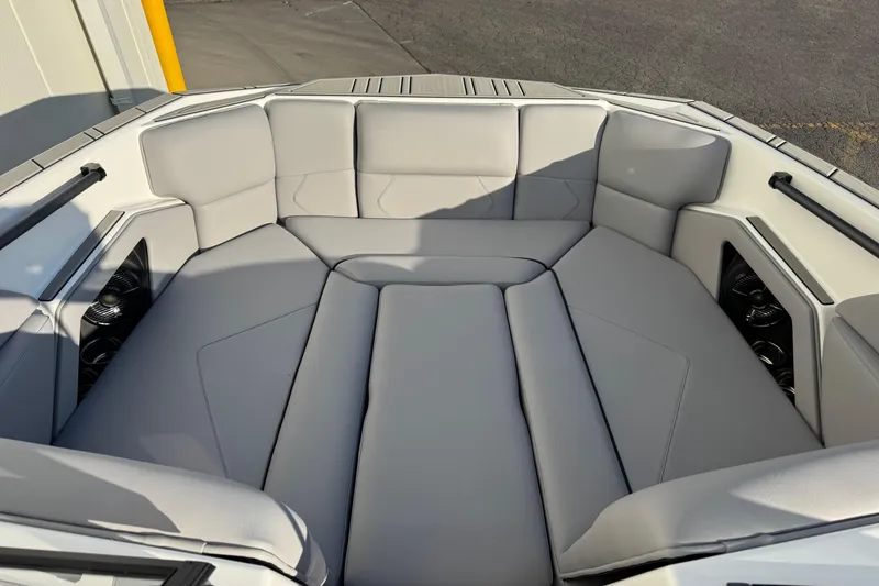 Slide: The Image of 2026 Moomba Tykon boat interior with gray cushioned seating and sleek design. - 10