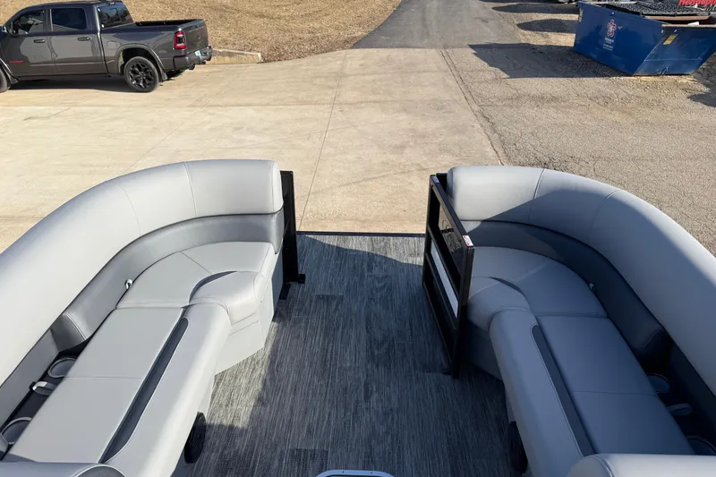 Slide: The Image of 2026 Bentley Pontoons Legacy 243 Navigator interior with gray seating and open deck view. - 10