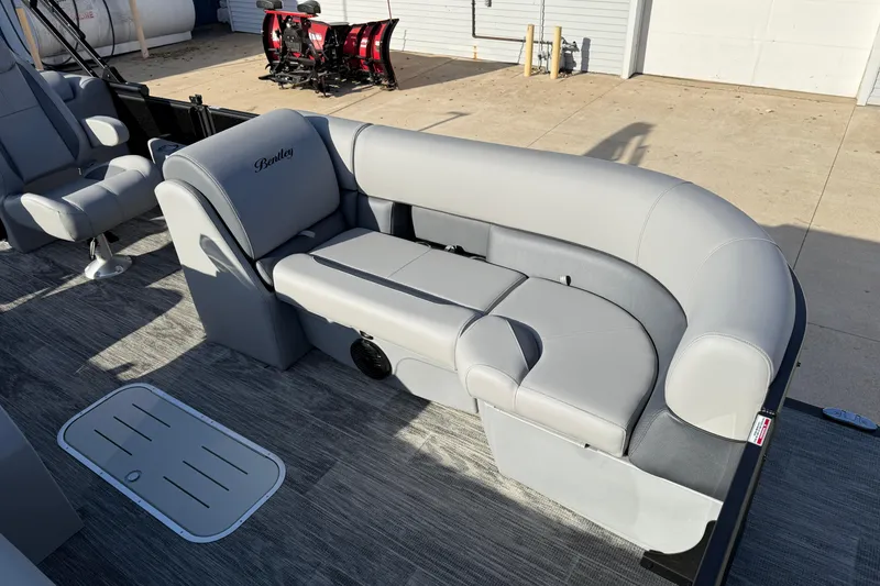Slide: The Image of 2026 Bentley Pontoons Legacy 243 Navigator with luxurious gray seating and modern design. - 13