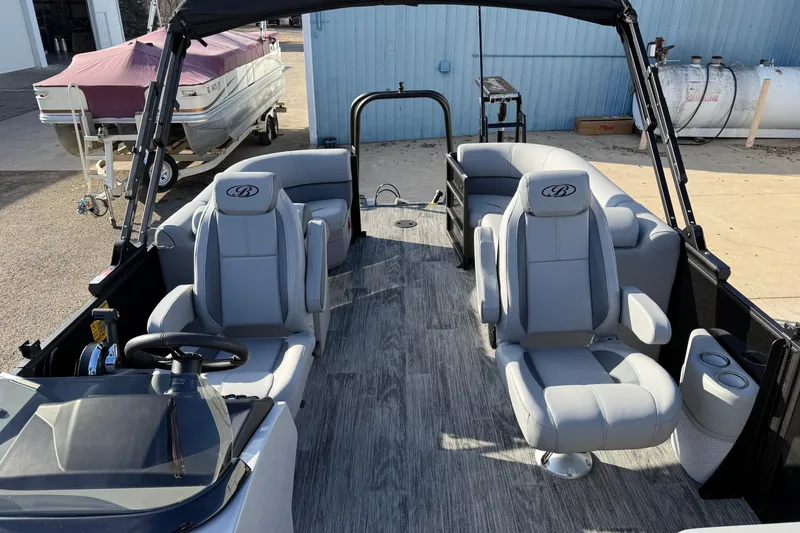 Slide: The Image of 2026 Bentley Pontoons Legacy 243 Navigator interior with luxurious seating and modern design. - 14