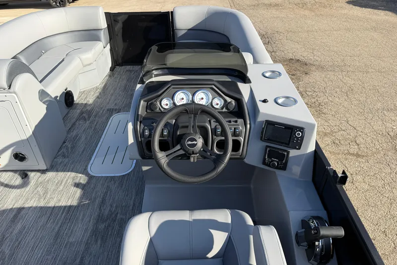 Slide: The Image of 2026 Bentley Pontoons Legacy 243 Navigator interior with modern dashboard and steering wheel. - 17