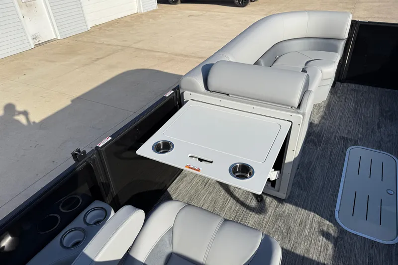 Slide: The Image of 2026 Bentley Pontoons Legacy 243 Navigator interior with gray seating and foldable table. - 20
