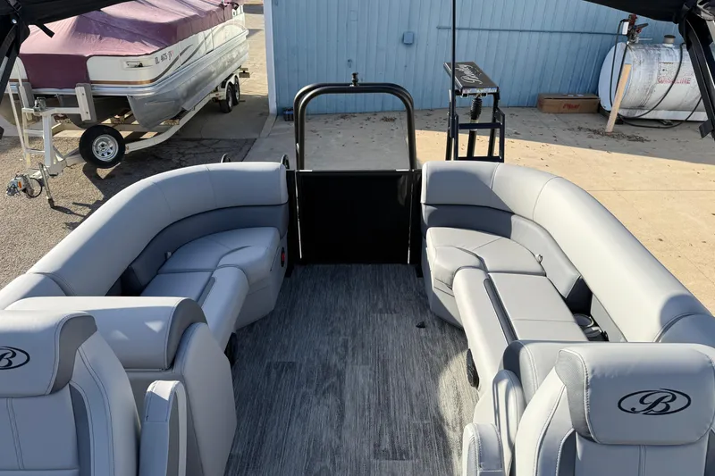 Slide: The Image of 2026 Bentley Pontoons Legacy 243 Navigator interior with gray seating and modern design. - 22
